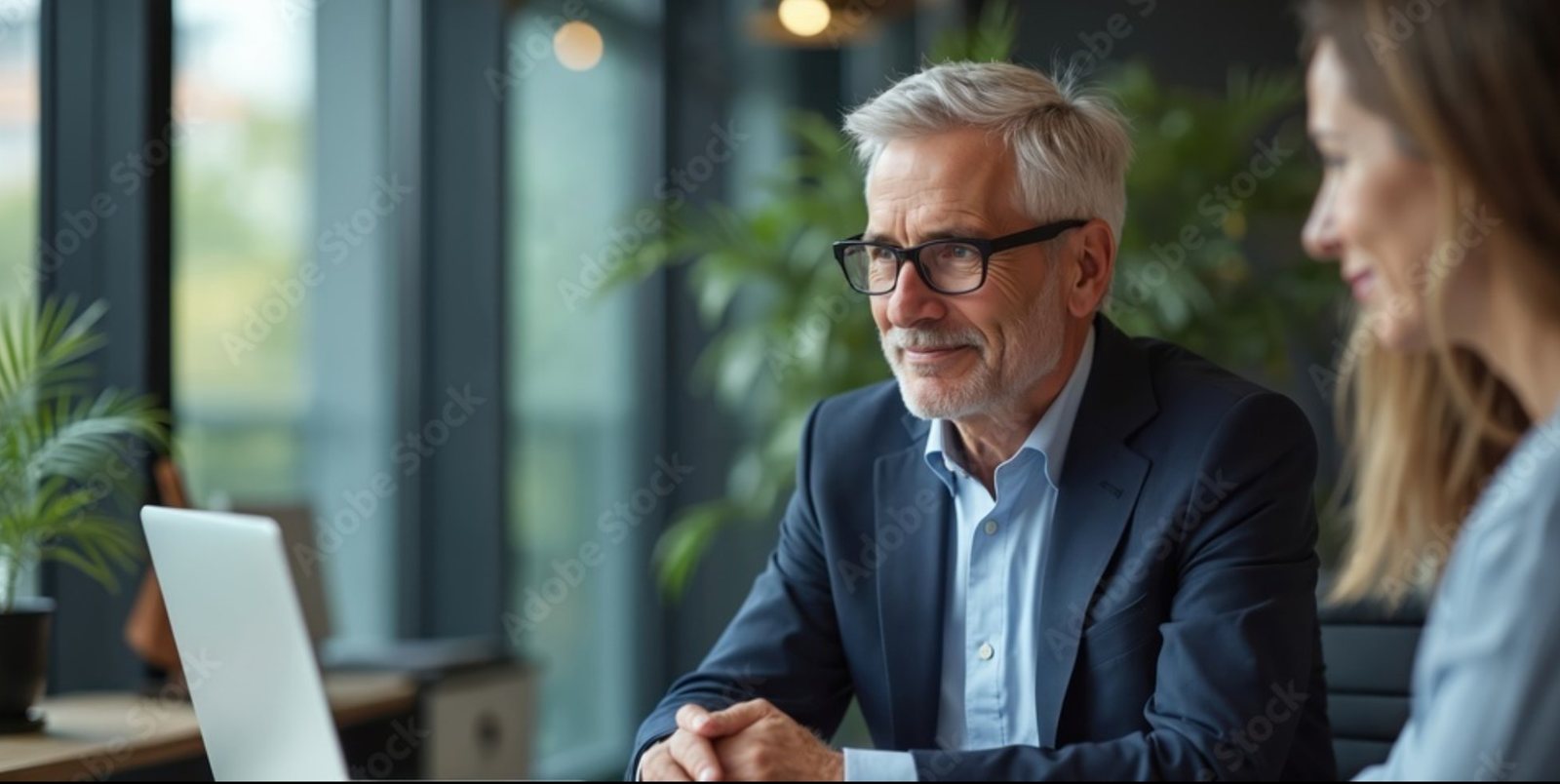An experienced Aner Group advisor working with a colleague